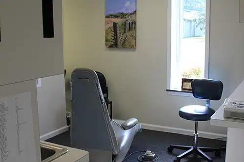 Modern dental examination room with chair, monitor, and equipment at Danville Family Dental office.